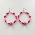 Blushing Candy Hoop Earrings on Soft White Background
